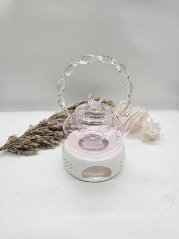 Théière en verre borosilicate rose à anse torsadée et délicat couvercle en forme de papillon